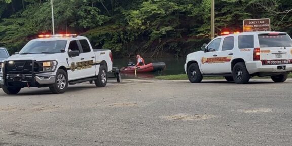 Prestonsburg Fire Department loaded boats into the water as they began the search for the missing swimmer.