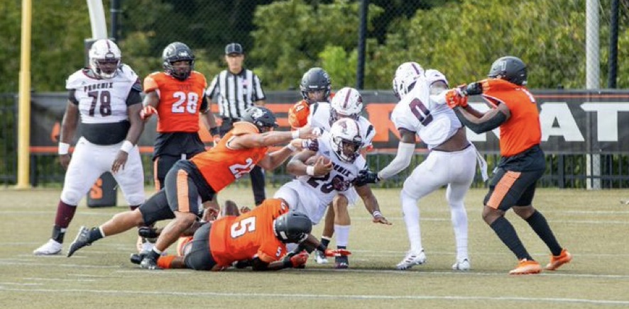 COLLEGE FOOTBALL: Georgetown upends UPIKE