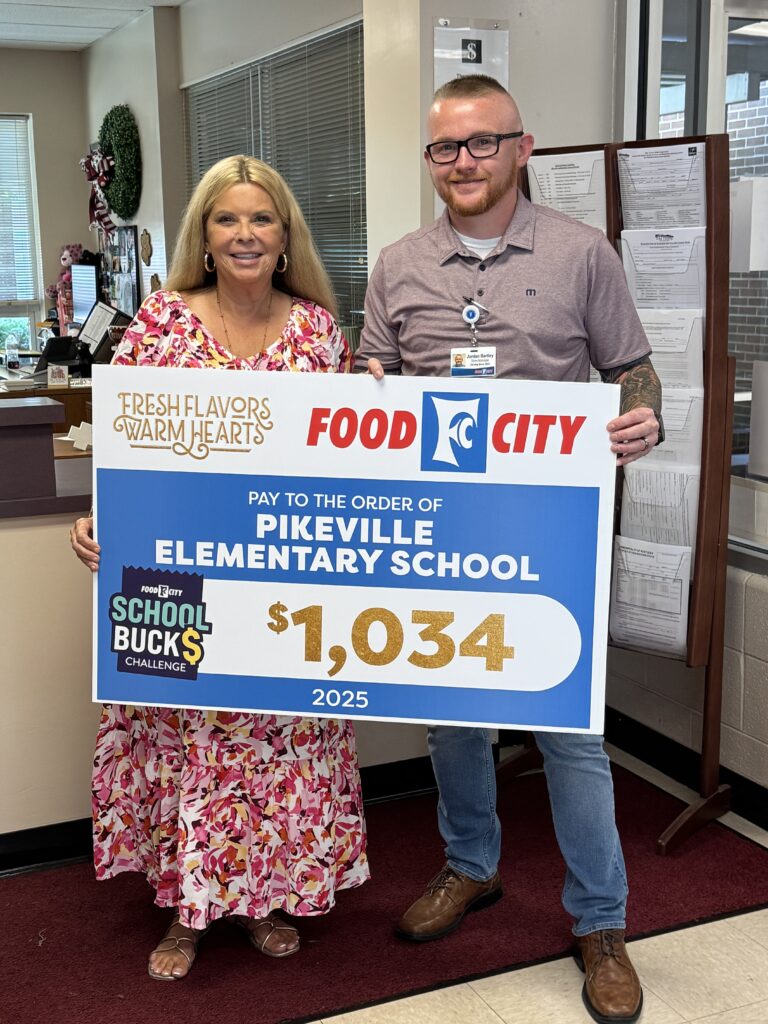 Food City officials are in the process of awarding $800,000 in contributions to area schools from their 2024-2025 School Bucks program. Food City Store Manager Jordan Bartley is shown presenting a check for $1,034 to Pikeville Elementary Principal Glenda Adkins.