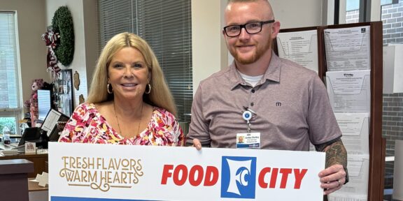 Food City officials are in the process of awarding $800,000 in contributions to area schools from their 2024-2025 School Bucks program. Food City Store Manager Jordan Bartley is shown presenting a check for $1,034 to Pikeville Elementary Principal Glenda Adkins.