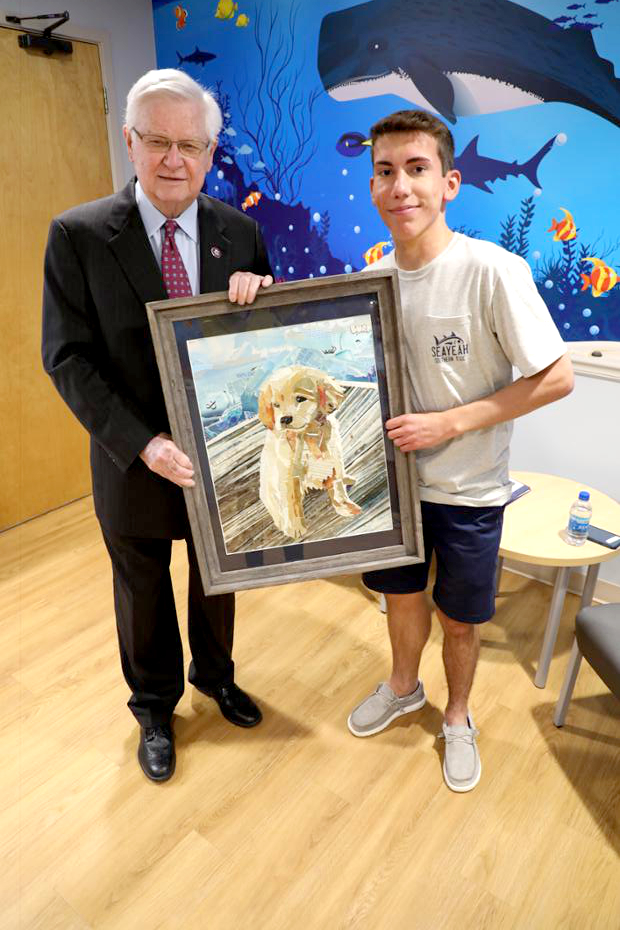Pikeville High School junior Andrew Justice, with U.S. Rep. Hal Rogers and his winning entry.