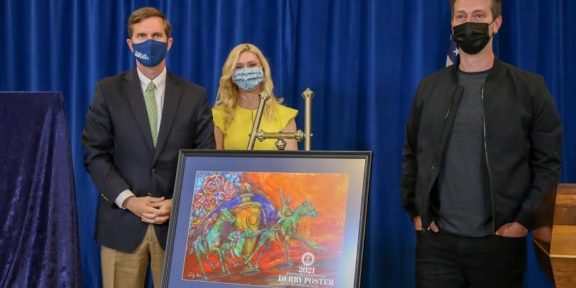 Gov. Andy Beshear and First Lady Britainy Beshear, with Kentucky Derby Festival poster artist Lennon Michalski and his creation.