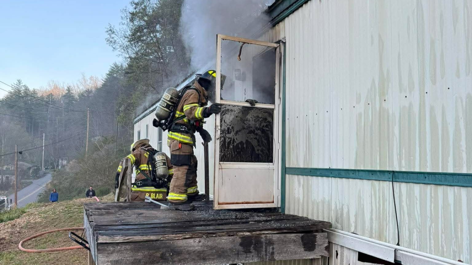 A W.R. Castle firefighter makes entry into the home.