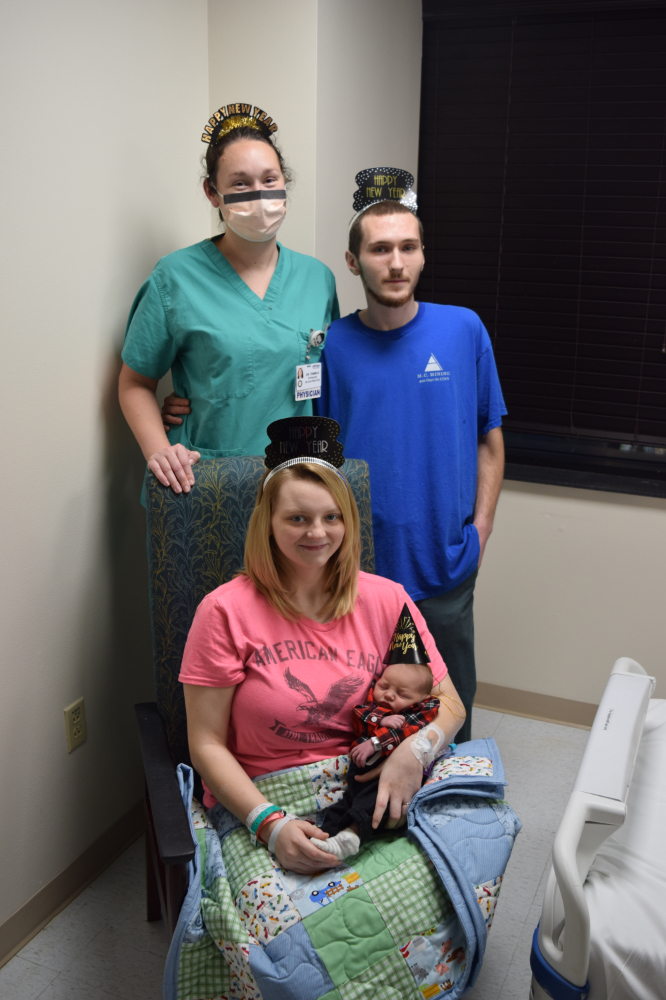 Baby Garrett Douglas Brewer, with mom Holly Ann Lewis, dad Cory Daniel Brewer and Dr. Hayley Trimble.