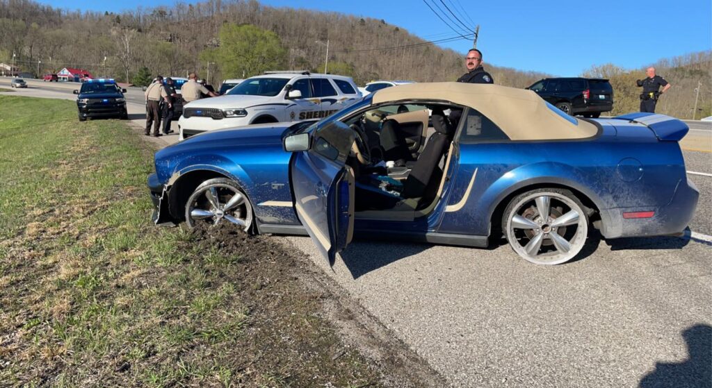 Adkins' vehicle continued to lead police on a chase at speeds of over 100 mph, despite having three flat tires from running over spike strips early in the pursuit.