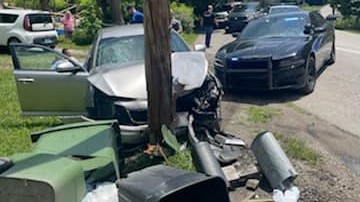 The chase came to an end after the driver crashed into a telephone pole.