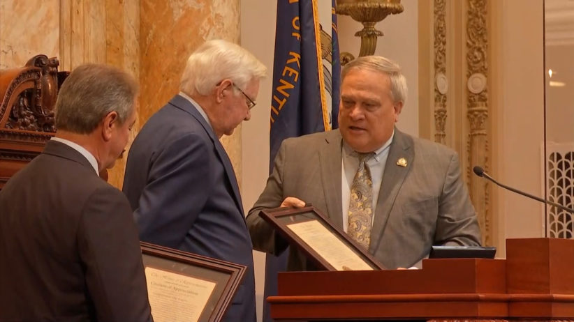 Senate President Robert Stivers, right, and House Speaker David Osborne, left, present U.S. Rep. Hal Rogers with citations honoring his service to the country. Rogers became Kentucky's longest-serving congressman on Thursday.