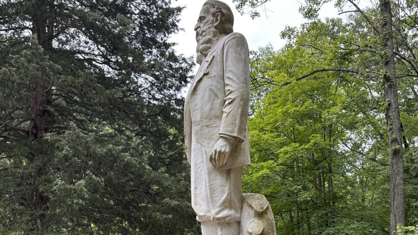 The statue of Hatfield patroarch Devil Anse Hatfield stands guard at the mountainside cemetery at Sarah Ann, West Virginia. It is on the National Register of Historic Places. (Photo by Emery Jeffreys)