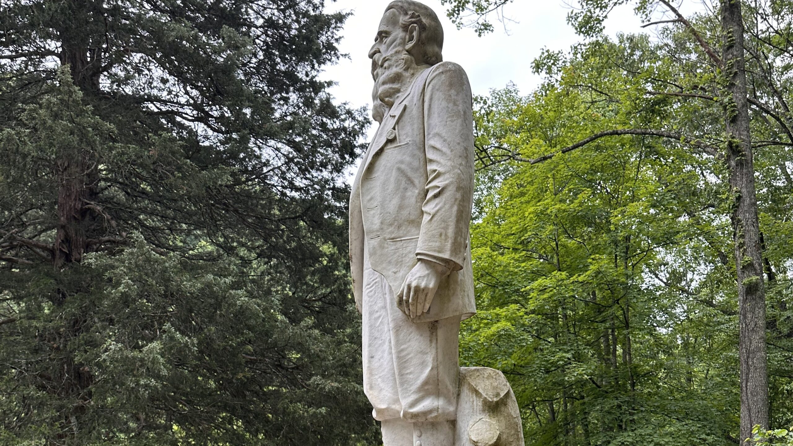 The statue of Hatfield patroarch Devil Anse Hatfield stands guard at the mountainside cemetery at Sarah Ann, West Virginia. It is on the National Register of Historic Places. (Photo by Emery Jeffreys)