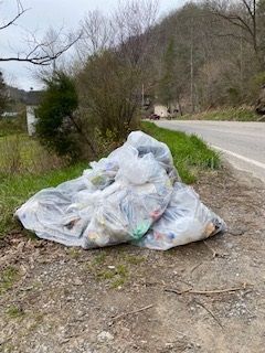 Bagged trash is ready to be collected.