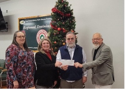 The Pike County Long-Term Recovery Group receiving their grant. From left to right, Suzie Savage, Sandy Penix, Jim Savage, and Randy Johnson.