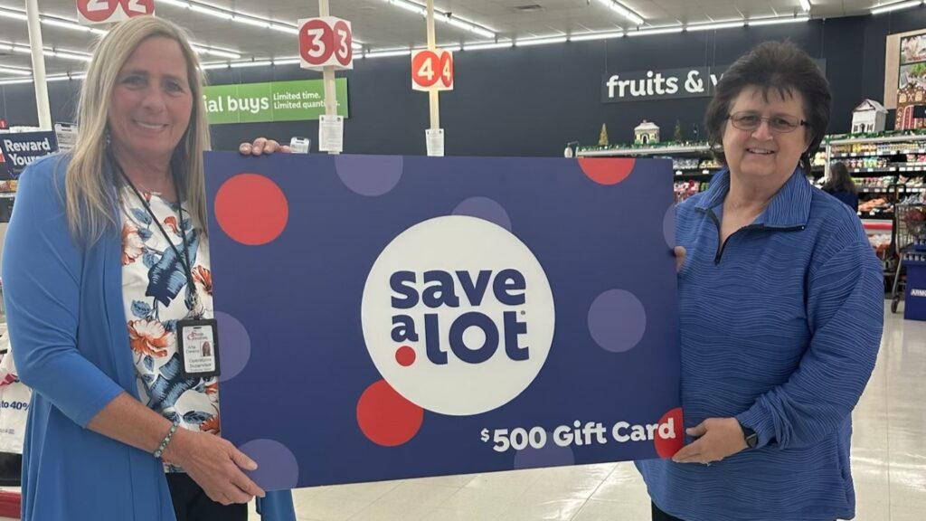 Save A Lot Saver Group Operations Supervisor Arla Owens presents the award to Tammy Amburgey, the Chairperson of the Middle Creek Community Development & Food Pantry in Prestonsburg.