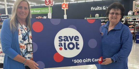 Save A Lot Saver Group Operations Supervisor Arla Owens presents the award to Tammy Amburgey, the Chairperson of the Middle Creek Community Development & Food Pantry in Prestonsburg.