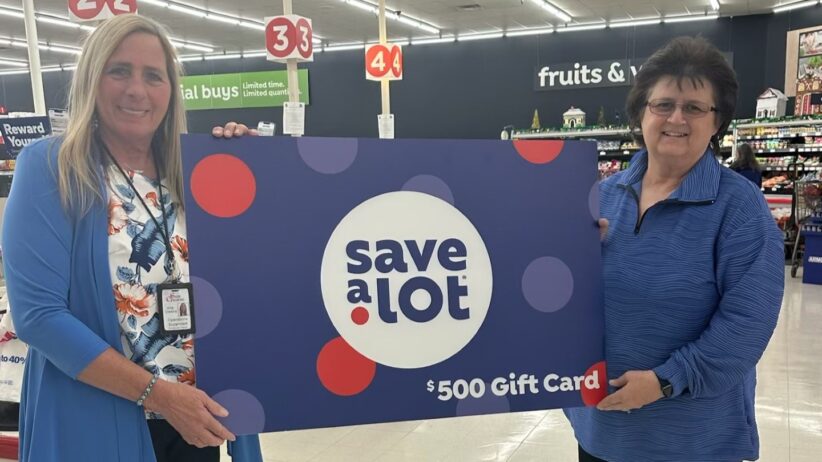 Save A Lot Saver Group Operations Supervisor Arla Owens presents the award to Tammy Amburgey, the Chairperson of the Middle Creek Community Development & Food Pantry in Prestonsburg.