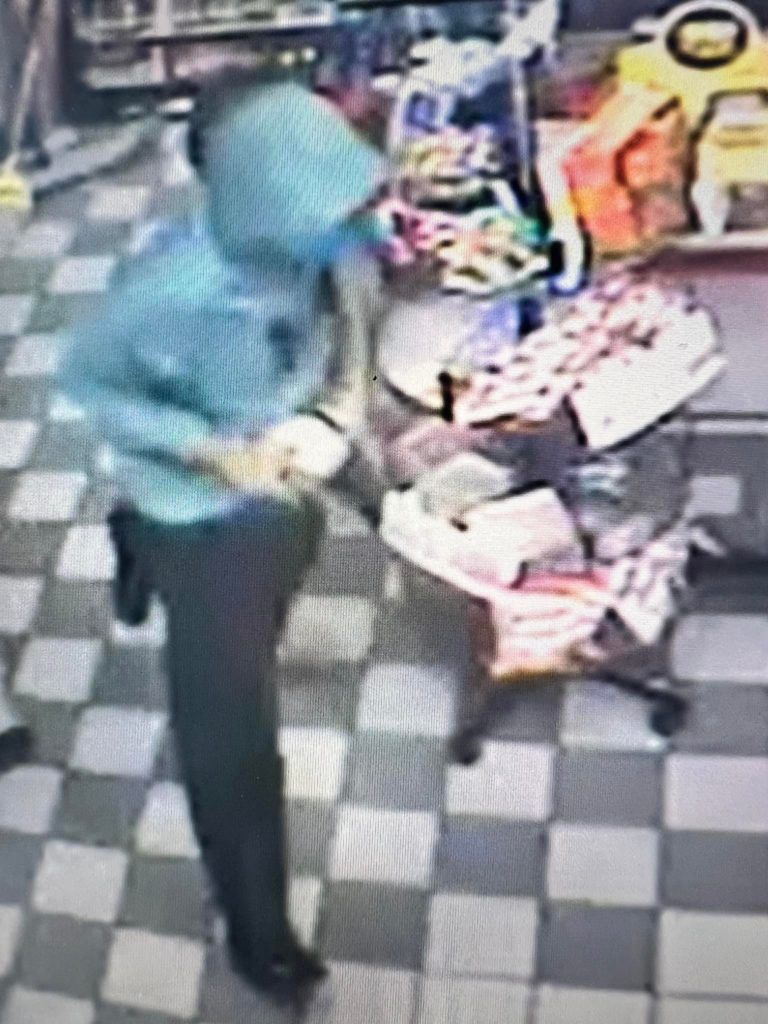 Security camera image of robber.